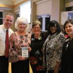 Village Green Retirement representatives accept the first-place award for best senior living facility. Olivia Sullivan/staff photo