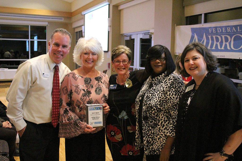 Village Green Retirement representatives accept the first-place award for best senior living facility. Olivia Sullivan/staff photo