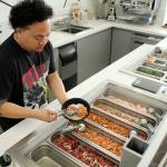 Sim Muna dishes up authentic poke at Federal Ways Big Island Poke. Olivia Sullivan/staff photo