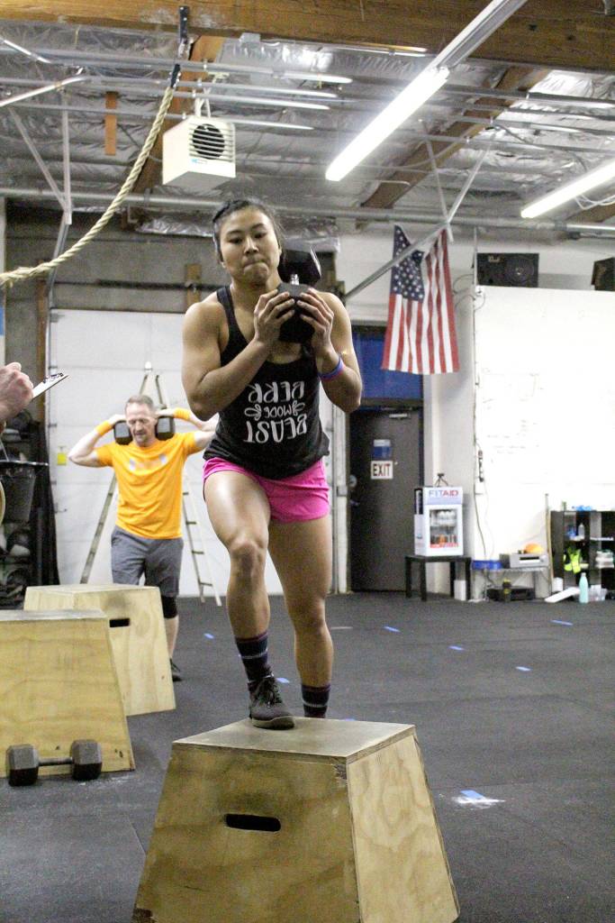 Amber Takara powers through her workout at CrossFit Federal Way on March 8. Olivia Sullivan/staff photo