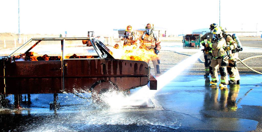Members of Team C extinguish an LPG prop car fire at Fire Ops 101. Photo courtesy of Craig Soucy