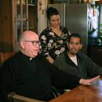 Father Steve Woodland, the Barcos priest at St. Philomena Church, pictured with Rocio and Bernardo in their Des Moines home. Haley Donwerth/staff photo