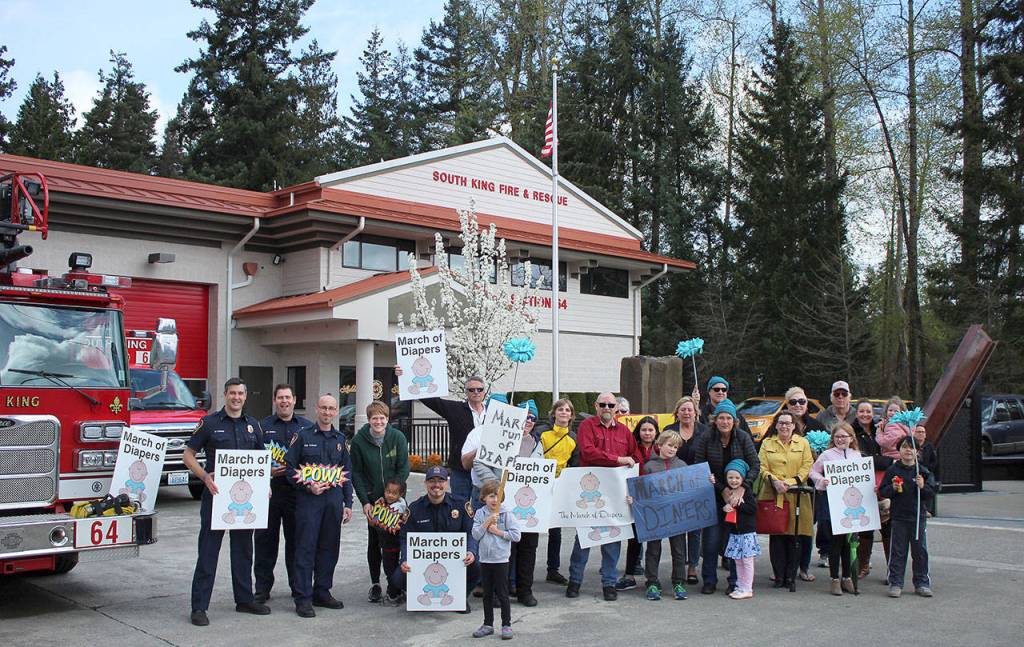 Supporters and community members gather at fire Station 64 to greet the runners at the finish line. Olivia Sullivan/staff photo