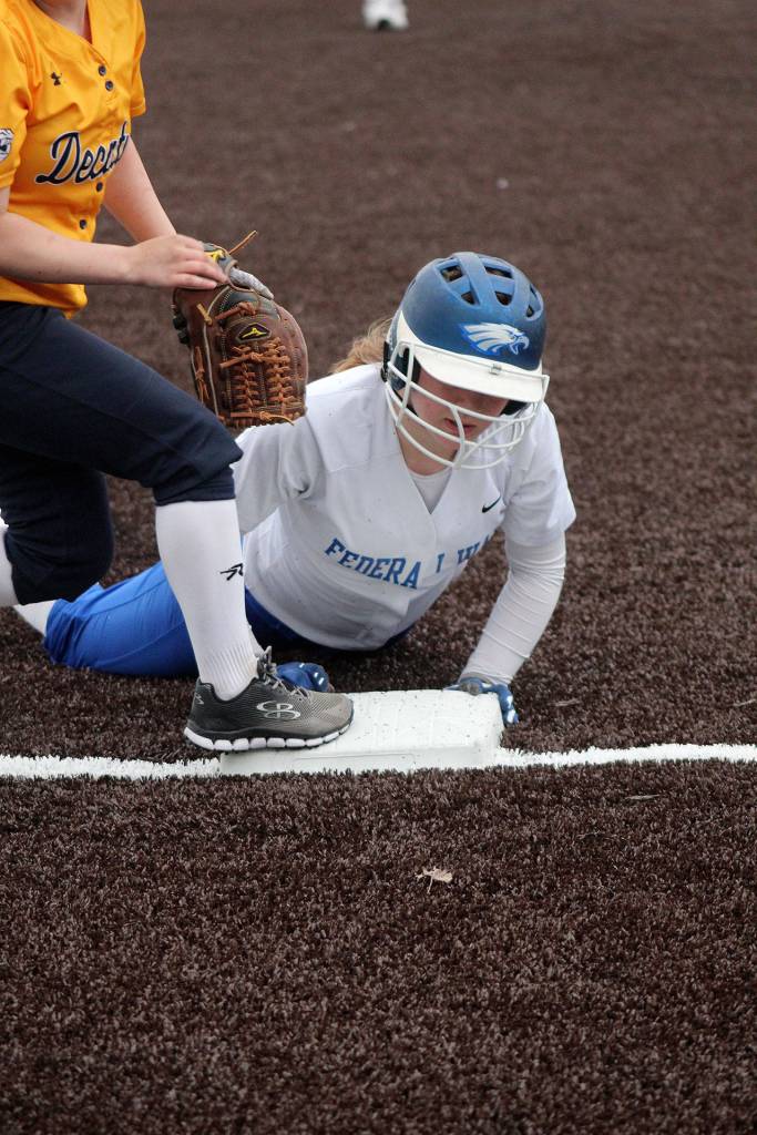 Federal Ways Casey Wright slides into third base at Tuesdays game against Decatur. Olivia Sullivan/staff photo