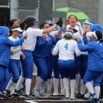 The Eagles greet Casey Wright at home plate after Wrights second home run of Tuesdays game. Olivia Sullivan/staff photo