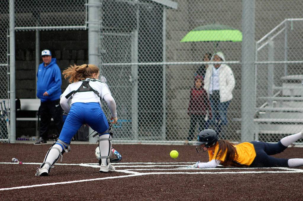 Close call: Decaturs Jordan Griffith safely makes it to home plate at Tuesdays game against Federal Way. Olivia Sullivan/staff photo