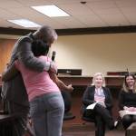 Judge Dave Larson embraces graduate Darnetta Berry at the Community Court graduation ceremony on April 18. Olivia Sullivan/staff photo