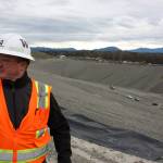 Scott Barden stands next to the pit that will house the newest, and possibly final, section of the Cedar Hills Regional Landfill near Maple Valley. The pit is 120 feet deep, and around another 180 feet will be built on top of it over the next decade. Aaron Kunkler/staff photo
