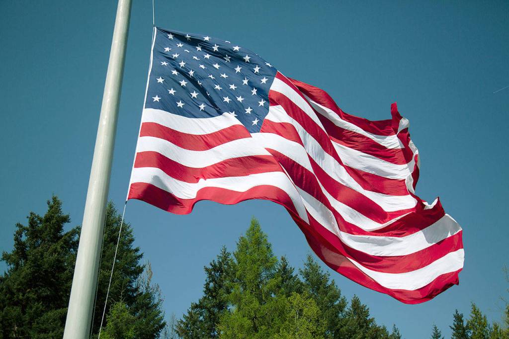The new flag on Woodbridge Corporate Park at half-staff for slain Cowlitz Sheriff Justin DeRosier. Photo courtesy of Woodbridge Corporate Park