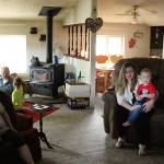 Cindy Lu Vaughn, left, sits in her living room as a longtime friend, Mary Elizabeth, visits with her son and nephew. Olivia Sullivan/staff photo