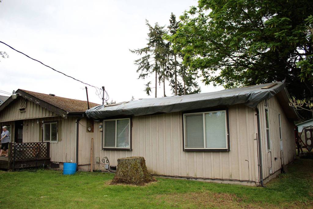 The Vaughns roof has been tarped over for years, leaving the room below unusable. Olivia Sullivan/staff photo