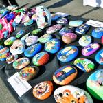 One of the tables at the farmers market offered decorative painted rocks. Photo courtesy of Bruce Honda