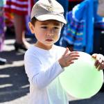 A little boy holds a balloon during the farmers market festivities. Photo courtesy of Shelley Pauls