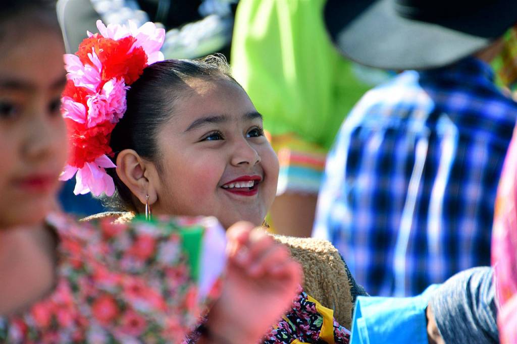 A little girl participating in the Folklore Mexicano Tonantzin smiles during a dance. Photo courtesy of Bruce Honda