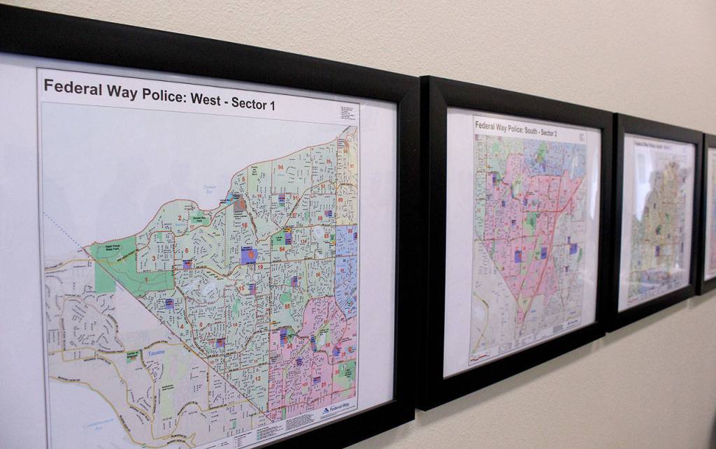 Maps of Federal Ways sectors hang on the wall at the new substation. Olivia Sullivan/staff photo