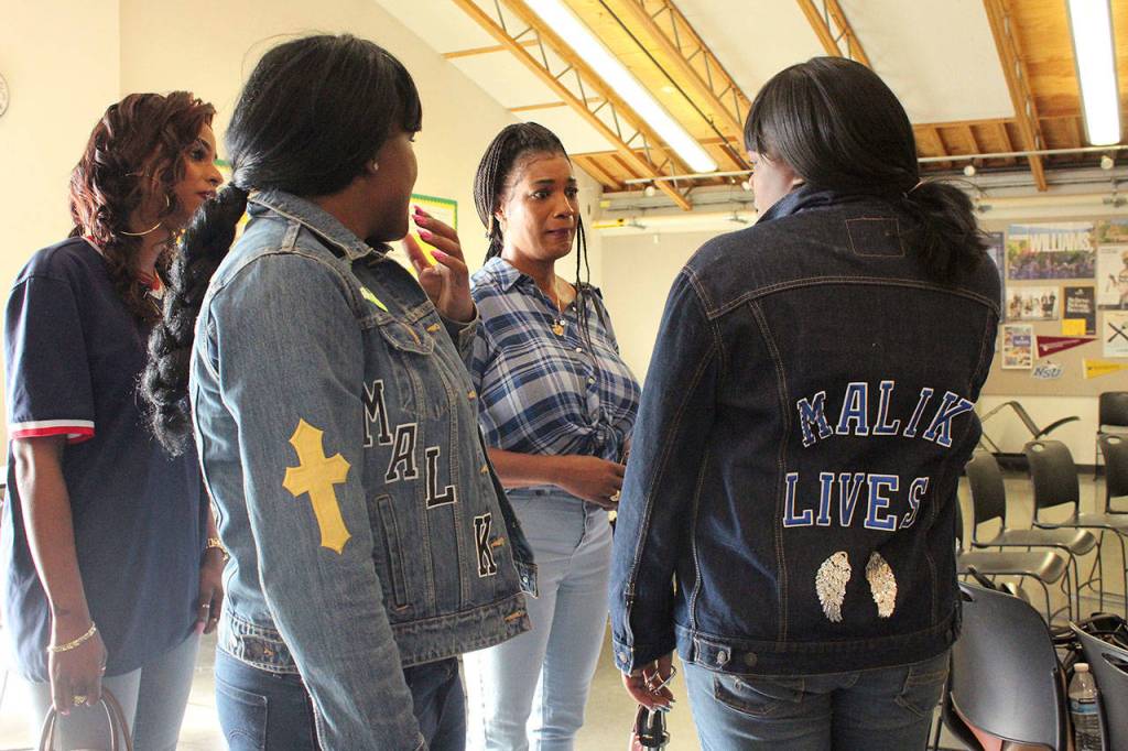 Family members of slain teens Cameron Wilson and Antonio Malik Douglas meet for the first time on Friday, June 14. Olivia Sullivan/staff photo