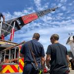 Crews of station 64 demonstrate how to operate the ladder truck. Photo courtesy of SKFR