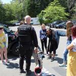 Melat W., 13, tries on protective gear used by the Federal Way police K9 unit. Olivia Sullivan/staff photo