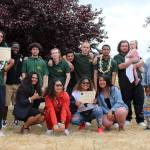 Graduates of the Northwest Credible Messenger Green Hill School pilot program, in green polos, proudly celebrate with the programs mentors after the ceremony on Friday, June 21. Olivia Sullivan/staff photo