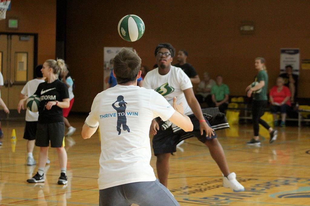 Donte Peoples practices passing drills at the StormCares clinic on July 8. Olivia Sullivan/staff photo