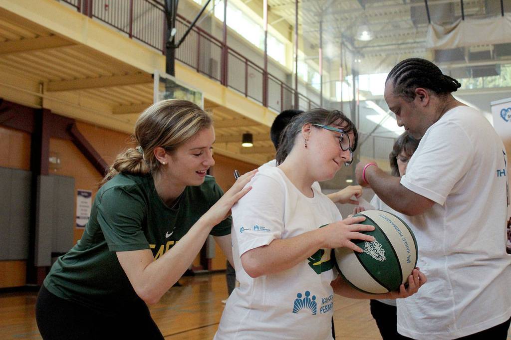 Blake Dietrick signs basketballs and tshirts after Mondays StormCares clinic for Special Olympics athletes. Olivia Sullivan/staff photo