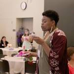 Kathie Nguyen blows out her birthday candle at Saturdays Celebrate 18! event. Olivia Sullivan/staff photo