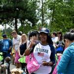 A female veteran waves to the camera during the Federal Way Vet Center barbecue that thanked women for their service to the armed forces. Haley Donwerth /staff photo