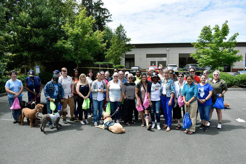 All of the female veterans in attendance at the Federal Way Vet Center barbecue smile for a photo. Haley Donwerth/staff photo