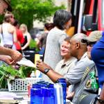 Attendees of the Federal Way Vet Center barbecue peruse tables before the honoring ceremony begins. Photo courtesy of Bruce Honda