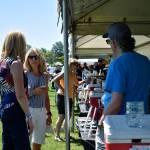 Event attendees taste one of the 20 local brews showcased at Rhythm and Brews. Haley Donwerth/staff photo