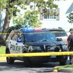 Federal Way police officers investigate the scene of a double stabbing at the Greystone Meadows Apartments on Friday morning. Olivia Sullivan/staff photo