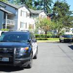 Federal Way police officers investigate the scene of a double stabbing at the Greystone Meadows Apartments on Friday morning. Olivia Sullivan/staff photo