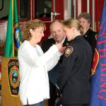 Lt. Shannon Oltman receives her pin from her mother on July 23. Olivia Sullivan/staff photo