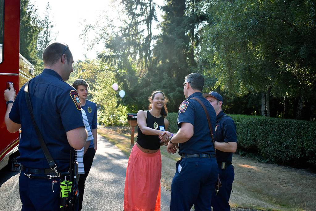 Some SKFR Firefighters mingling with residents. Haley Donwerth/staff photo