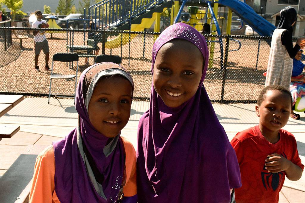 Kids smile for the camera at the Kitts Corner National Night Out neighborhood party. Haley Donwerth/staff photo
