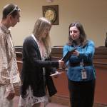 Judge Rebecca Robertson hands a certificate of completion to Bridie Clevenger at the Federal Way Municipal Court Community Court graduation ceremony on Aug. 8. Olivia Sullivan/staff photo