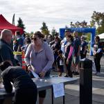 Dozens of people gathered at the start and finish line of the Run with a Cop 5K at the Federal Way Community Center Aug. 24. Haley Donwerth/staff photo