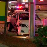 A car crashed into a light pole around 9 p.m. after a fatal hit-and-run collision in Federal Way on Sunday. Photo courtesy of Evergreen Media Production