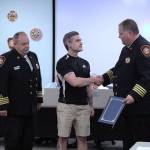 Ry Keener, middle, shakes hands with Assistant Chief Kevin Crossen during Tuesday nights citizen recognition. Olivia Sullivan/staff photo