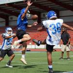 A kick by sophomore Randy Ortiz is blocked by another Federal Way player at preseason practice on Aug. 30. Olivia Sullivan/staff photo