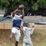 Decatur junior Tyler Satterwhite leaps to catch a pass at a Saturday morning preseason practice. Olivia Sullivan/staff photo