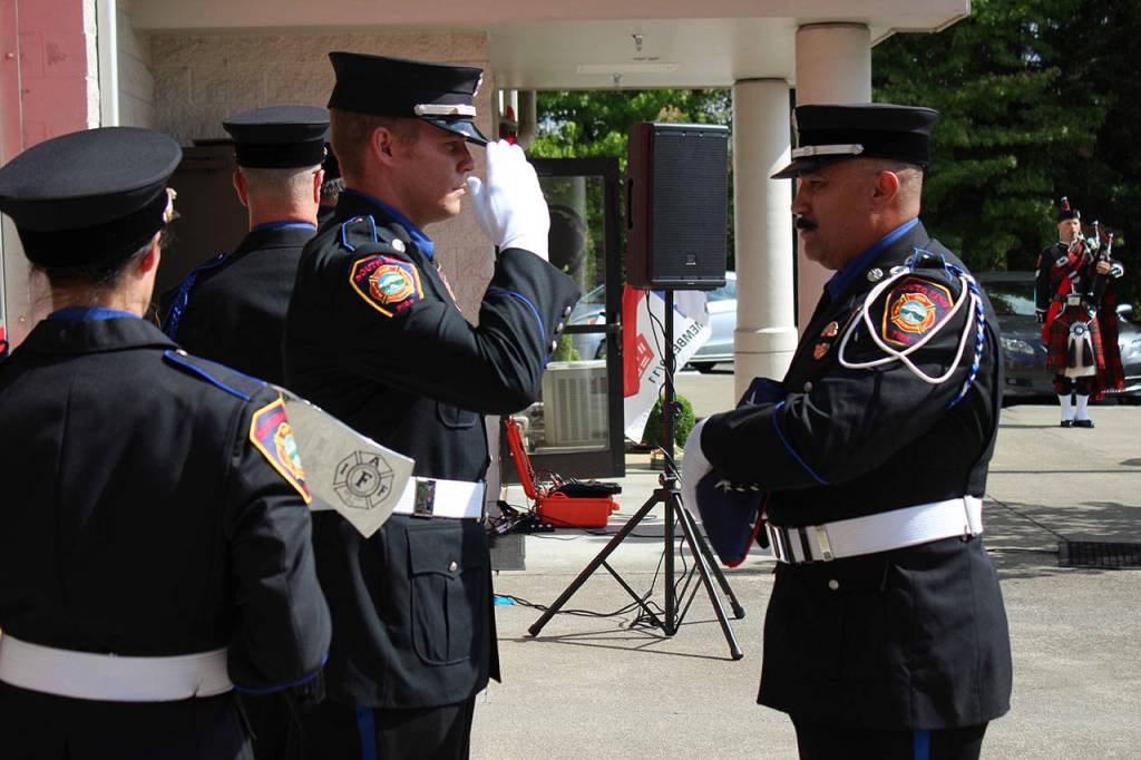 A member of South King Fires Honor Guard salutes the American flag prior to Wednesdays event. Olivia Sullivan/staff photo
