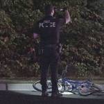 A police officer stands near the bike that was struck during a hit-and-run that killed a 34-year-old bicyclist in Federal Way on Friday morning. Photo courtesy of Evergreen Media Production