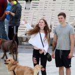 A girl tosses a tennis ball into the water for her dog to retrieve at Paw-Pool-Ooza on Sept. 14. Olivia Sullivan/staff photo