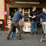 Mayor Jim Ferrell greets a resident during the Mayors Month of Concern Food Drive in front of the Grocery Outlet last week. Photo courtesy of Shelley Pauls