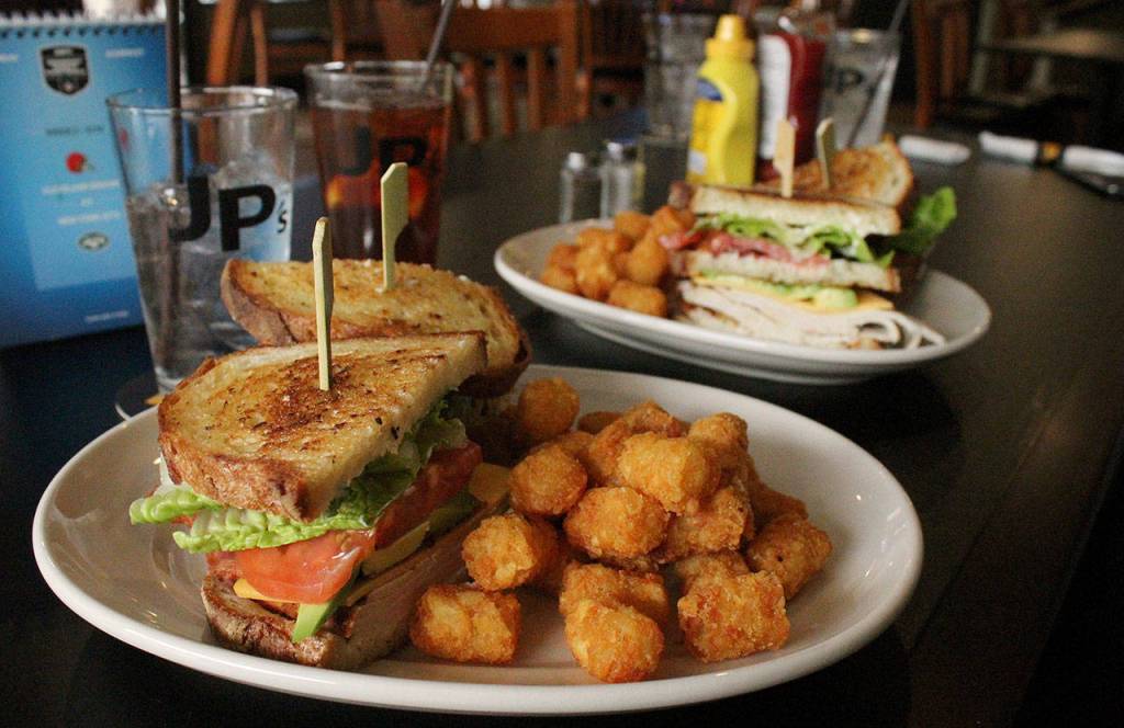 JPs Tavern turkey club sandwich with a side of Tater Tots. Olivia Sullivan/staff photo