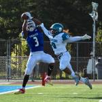 Federal Ways Ronald Davis III hauls in a touchdown pass in front of Auburn Riversides Thaddeus Umi-Tuatoo during first-half play Friday. Davis caught a pair of TDs in the Eagles win. Olivia Sullivan/staff photo