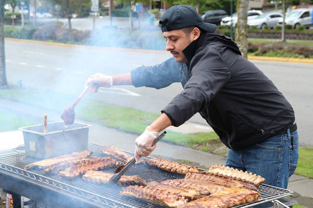 A Jimmy Macs Roadhouse cook prepares the restaurants sampler dish for the Taste of Federal Way.