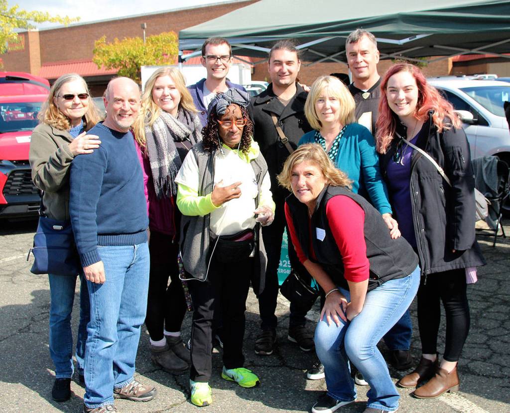 Betty Taylor, center in green, was given the third annual Dick Mayer Community Award. Taylor is pictured with Do the Right Thing nonprofit founder Cheryl Hurst, in red, and members of Dick Mayers family.