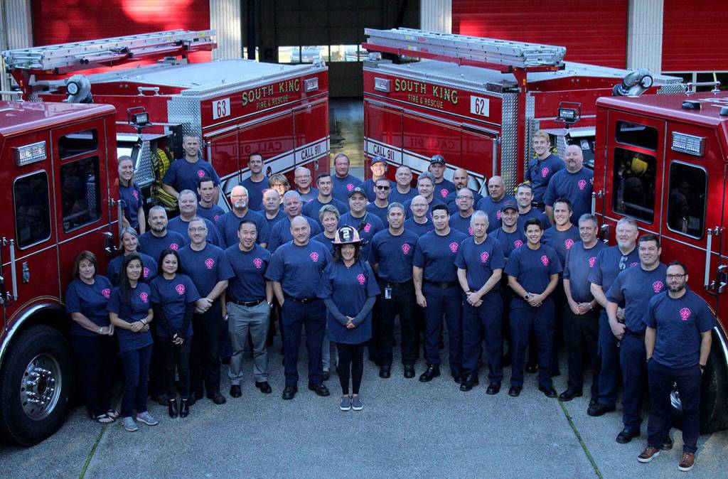 South Kings administrative team, crews from stations 67, 65, 63 and 62, and various Local 2024 members gather to show department-wide support of Breast Cancer Awareness month. Olivia Sullivan/staff photo